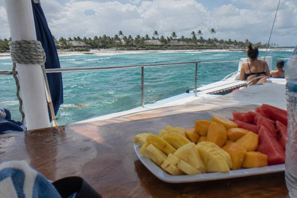 Catamaran deck with drinks and balloons ready for a celebration cruise