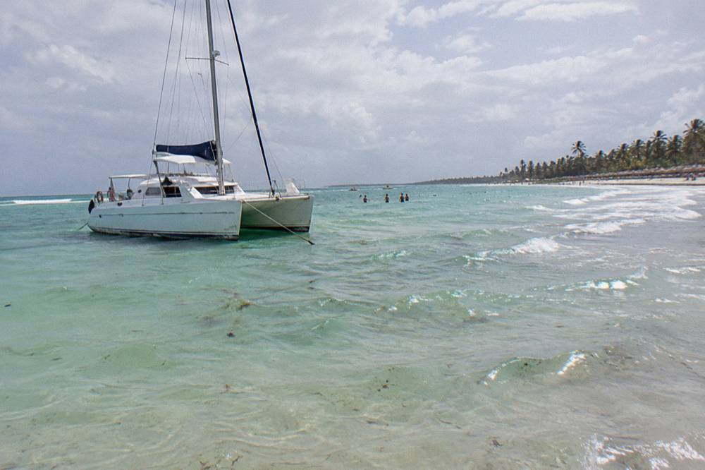 Clear shallow water at a natural pool sandbar with soft sand and gentle waves
