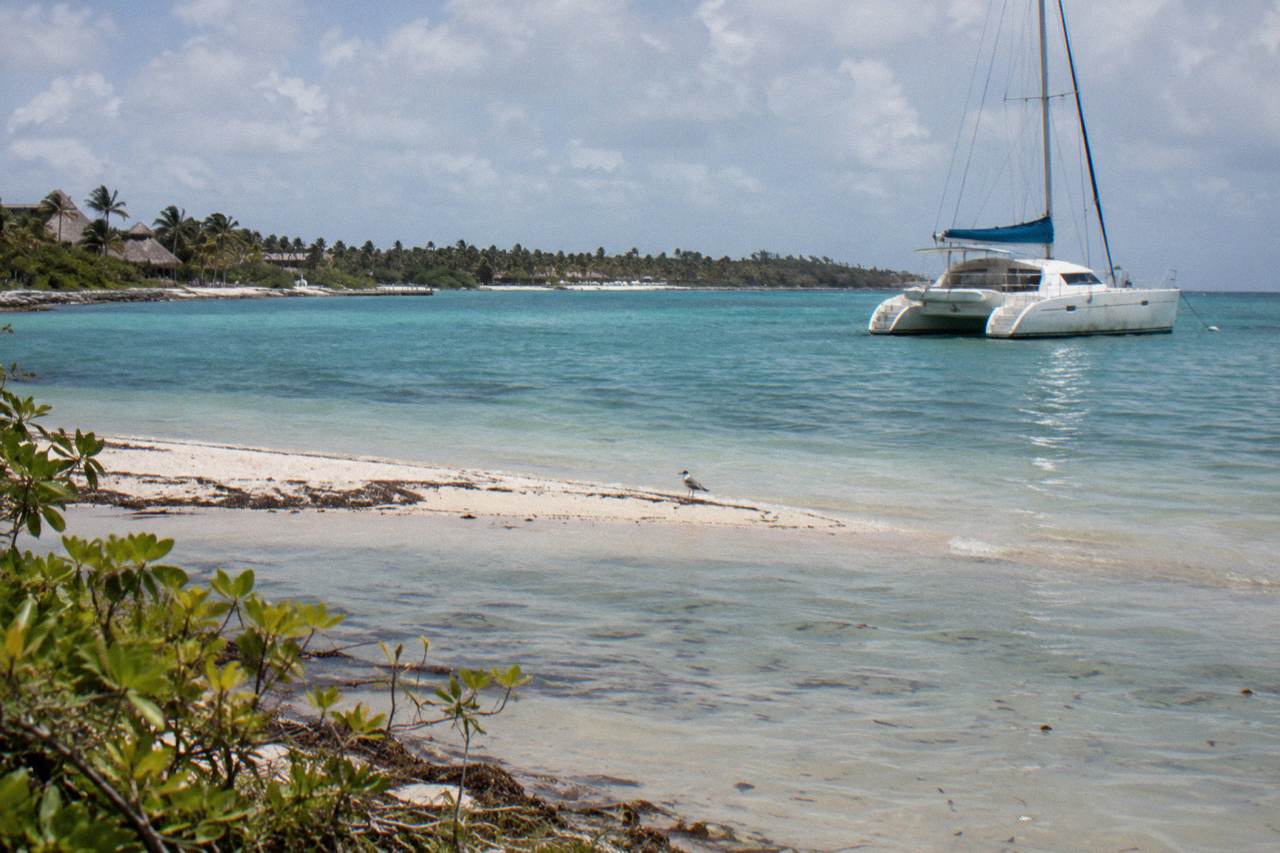 Private catamaran anchored over a shallow sandbar near the Punta Cana coast